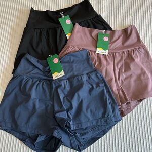 Halara High Waisted Back Pocket & Side Hidden Pocket 2/1 Yoga Shorts 2.5"
